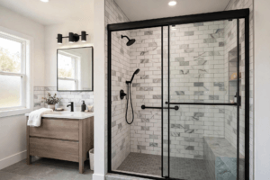 Bathroom design idea — tub-to-shower conversion with glass door and matte black fixtures